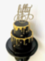 Black 2-tier cake with gold drips