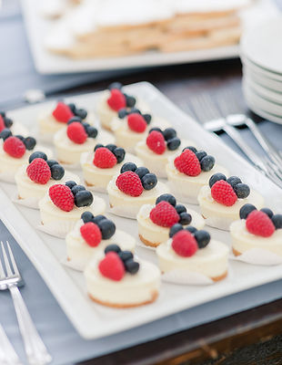 Bite size New York cheesecakes topped with fresh berries